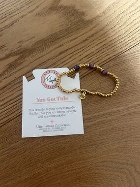 You Got This Gold Beaded Bracelet with Purple Gemstones